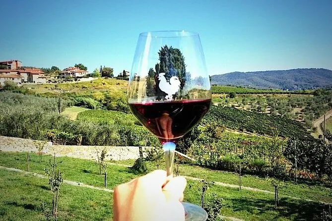 Savoring glass of Chianti in the vineyards of Tuscany